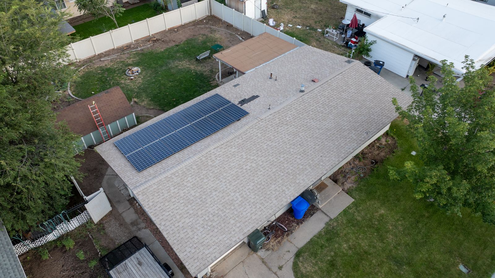 Light gray asphalt shingle roof with a solar array, with every slope, vent and edge clearly visible for a before-the-storm record. The NuRoof Guys.