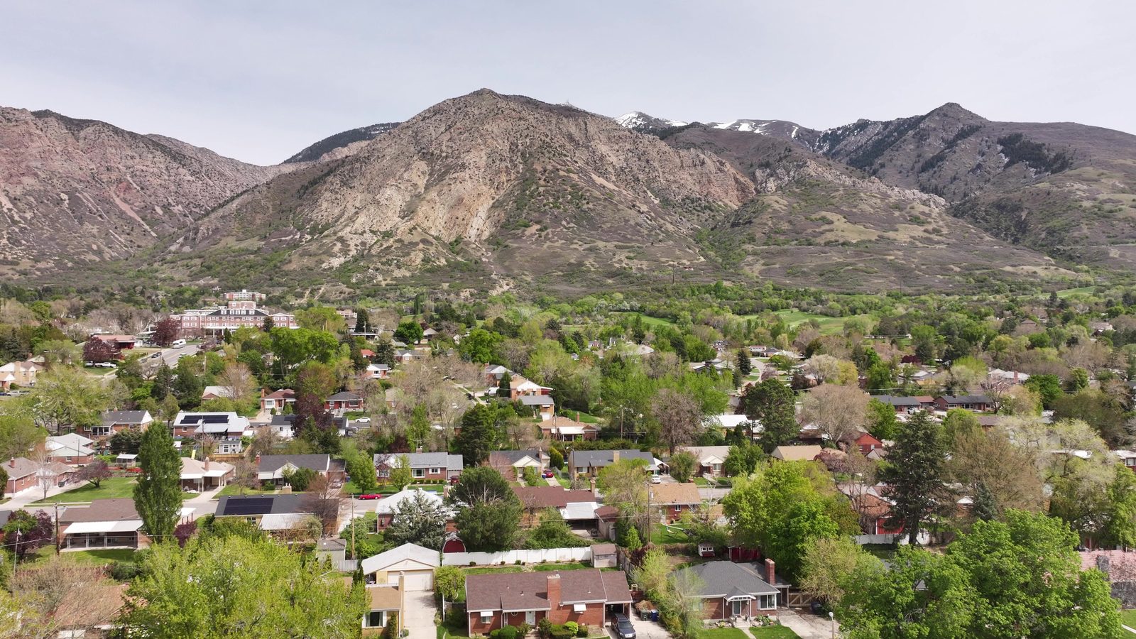 Drone view of a Utah neighborhood at the base of the Wasatch foothills