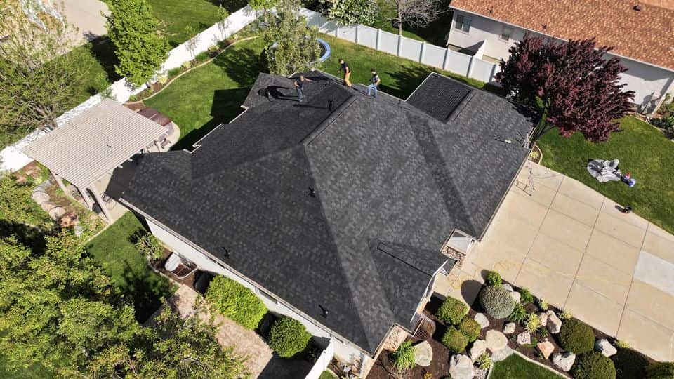 A dark asphalt shingle roof on a Utah home. The NuRoof Guys.