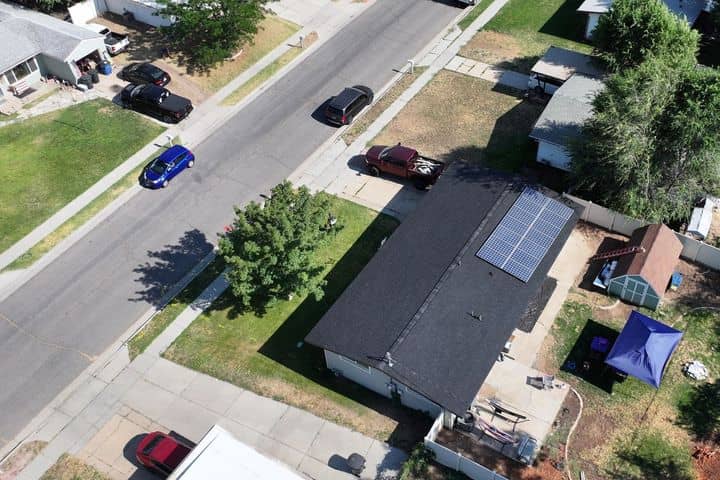 A Utah home with a light asphalt shingle roof. The NuRoof Guys.