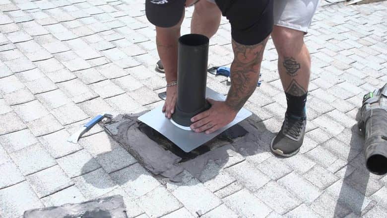 New flashing installed around a roof pipe. The NuRoof Guys.